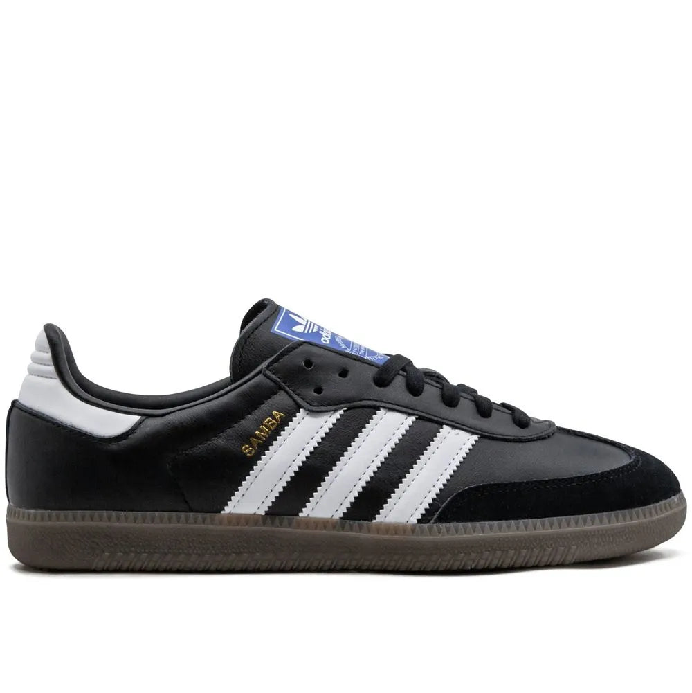 Black Adidas sneaker with white stripes on a white background