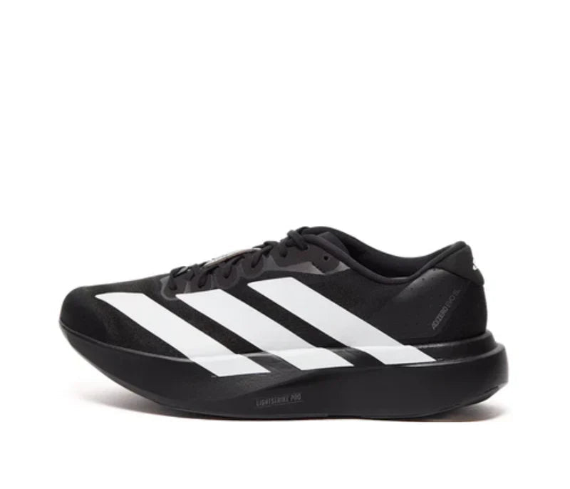 Black Adidas sneaker with white stripes on a white background