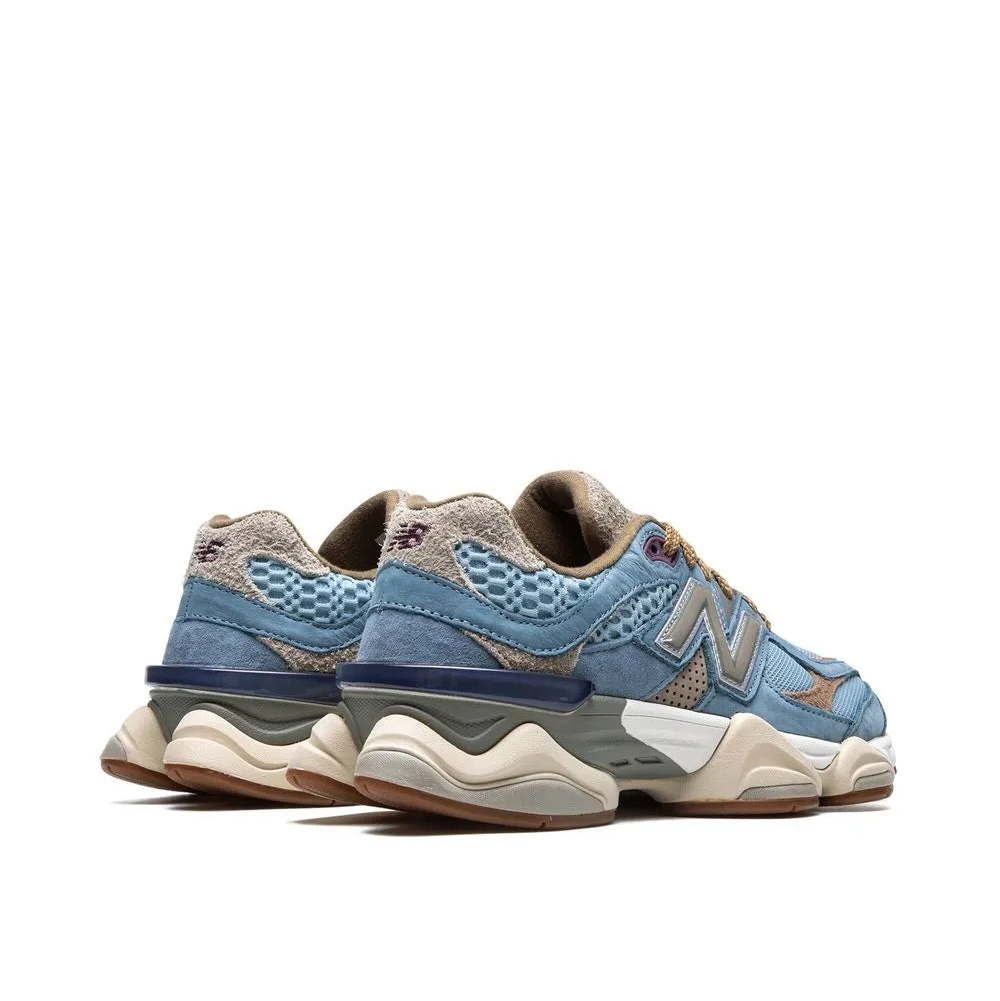 Pair of blue and beige sneakers on a white background