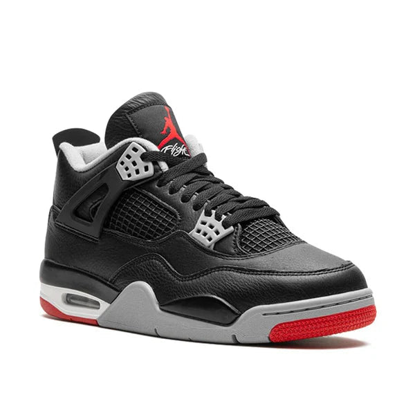 Black and gray sneaker with red accents on a white background