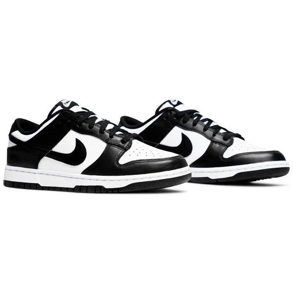 Black and white NIKE sneakers with a prominent logo on a white background